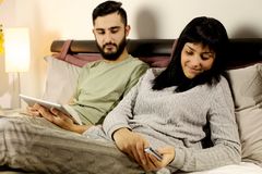 woman-bed-texting-message-boyfriend-jealous-looking-happy-girl-47994707